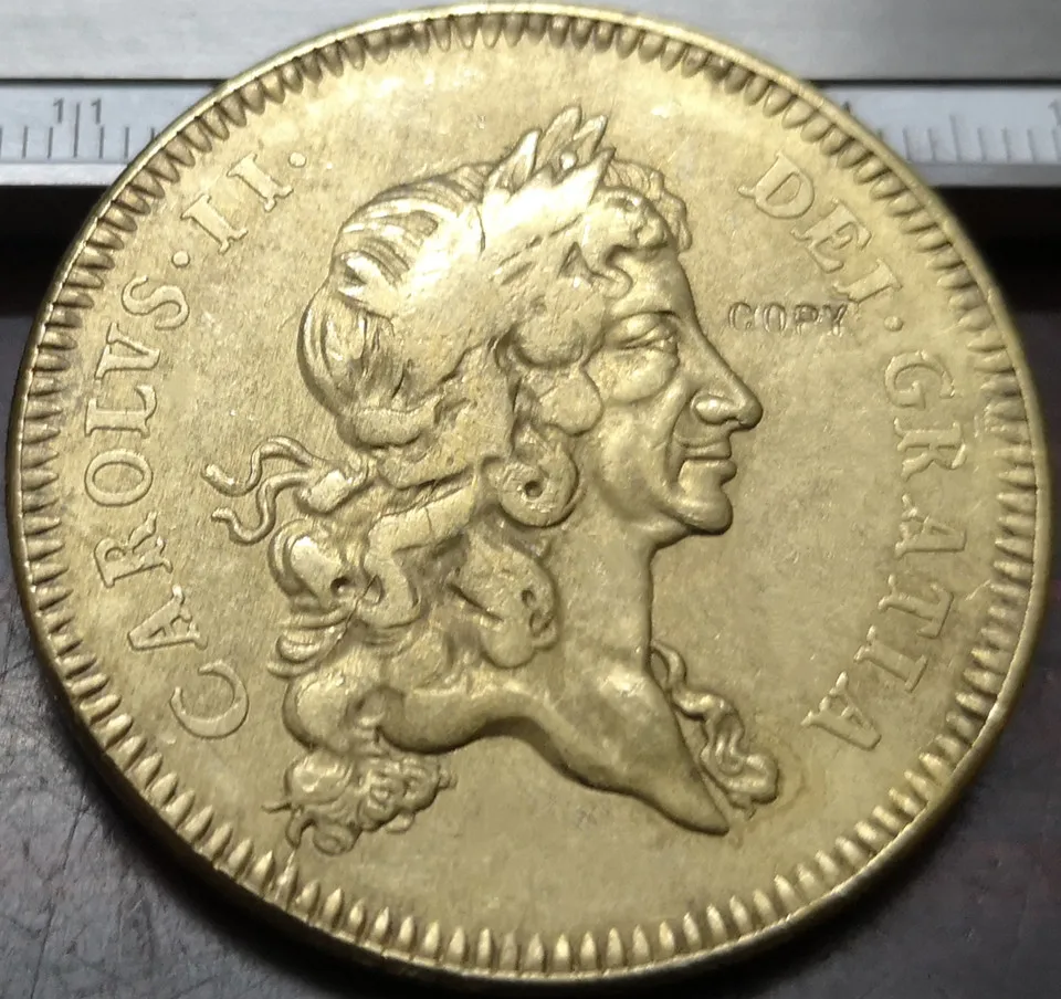 

Копия монеты 1672 Англия 5 Guineas - Charles II .9999 чистое золото