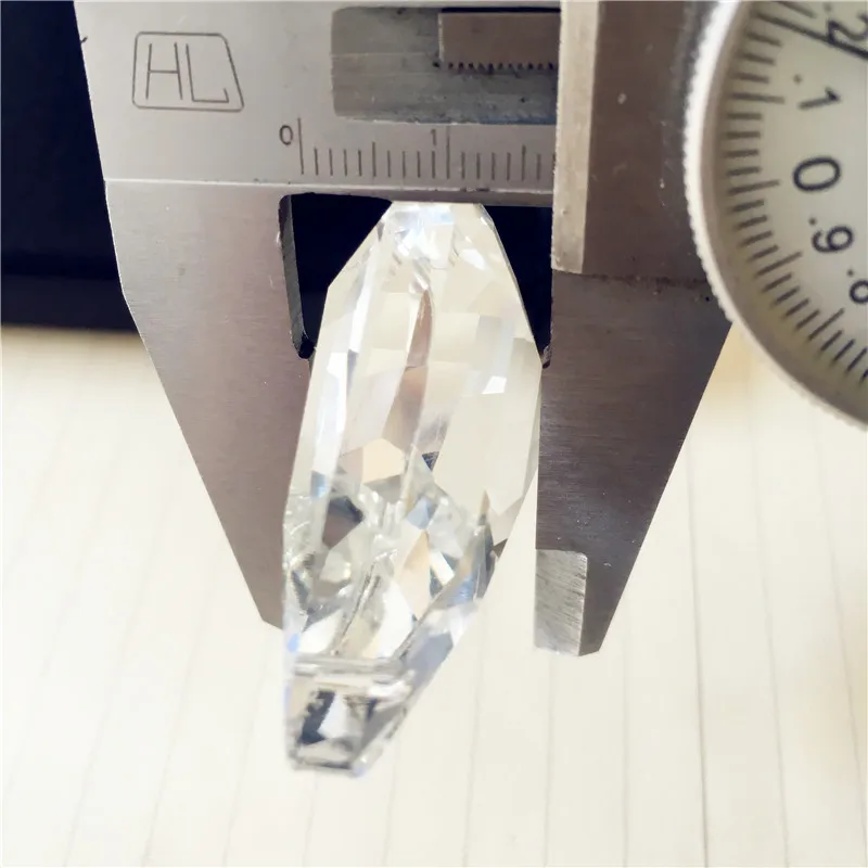 

Hot 100pcs 50*33*17mm Hanging Chakra Crystal Suncatcher Crystal Prism Pendants Handmade Transparent Chandelier Pendants.