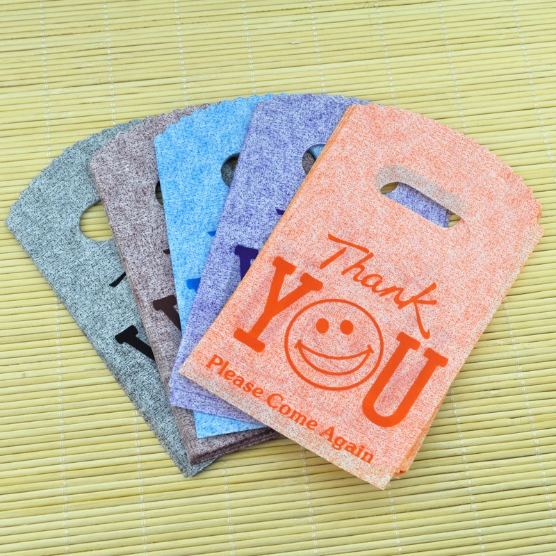 

100pcs 9x15cm small plastic gift bags smile thank you color random color plastic Pouches for jewelry Boutique gift