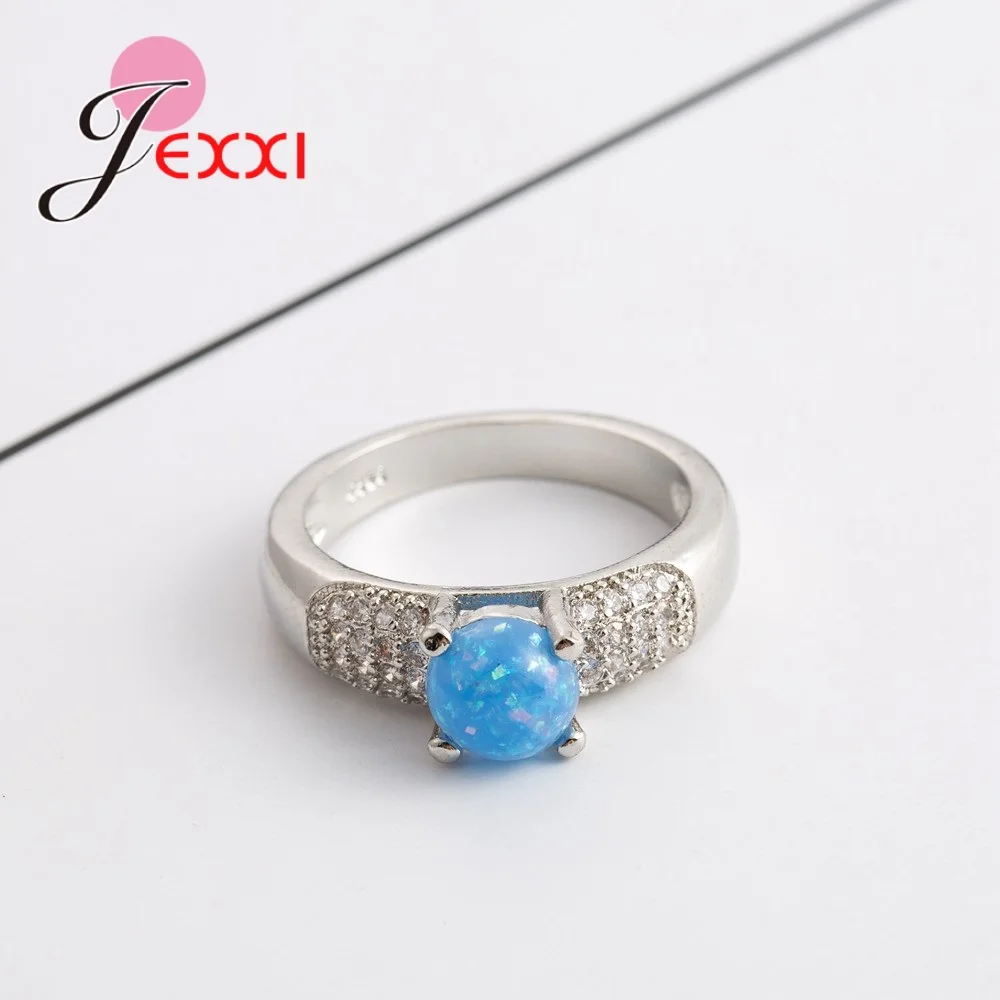 Женское ювелирное изделие с круглым опалом серебро 925 пробы