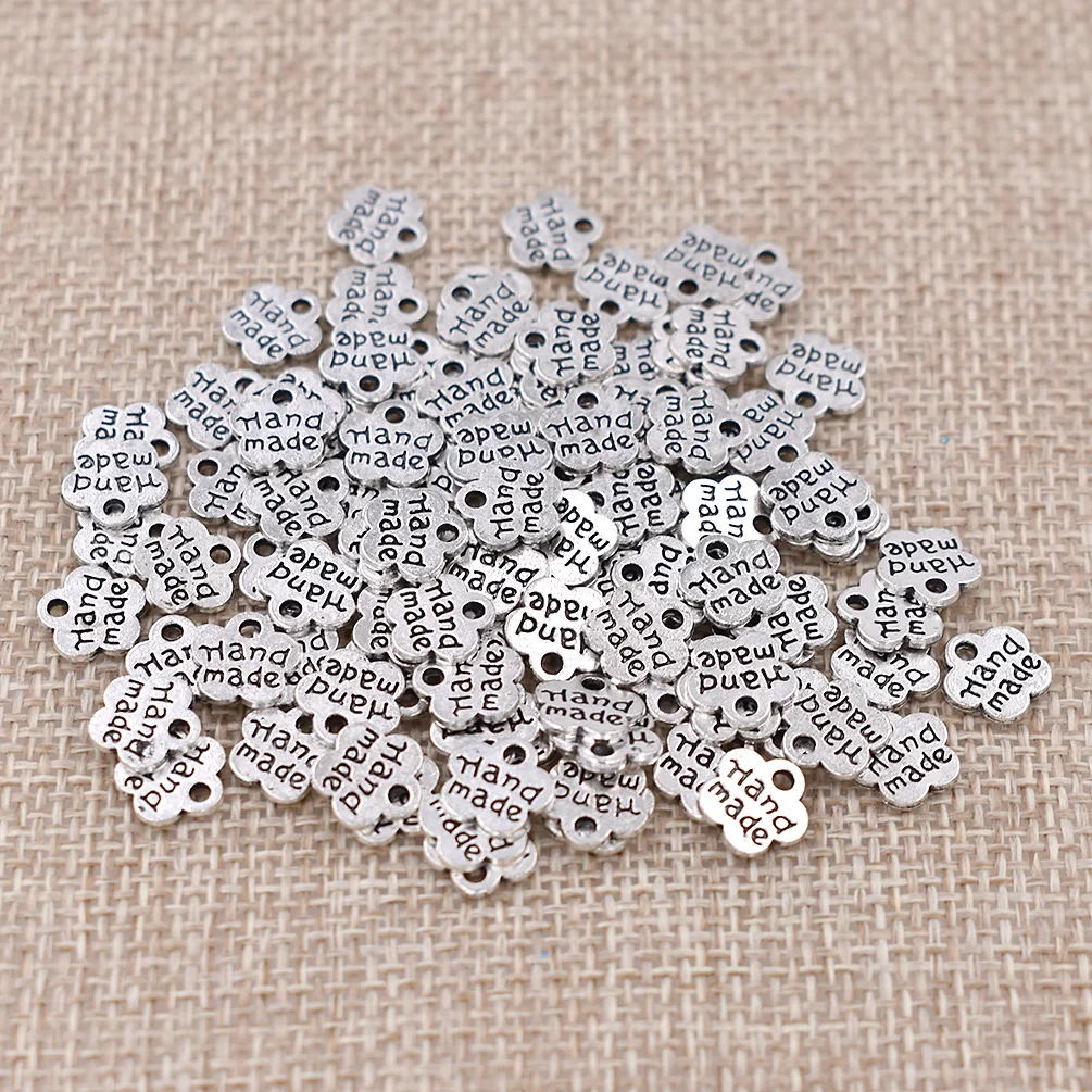 Ancient silver 100 шт. винтажные металлические этикетки в форме цветка сливы ручной работы для рукоделия бирки для одежды DIY Швейные принадлежности - Цвет: Ancient silver