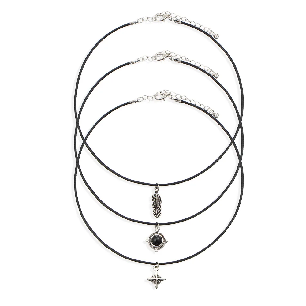 Бархатные ожерелья с перьями листьями звездами кулонами из черного камня