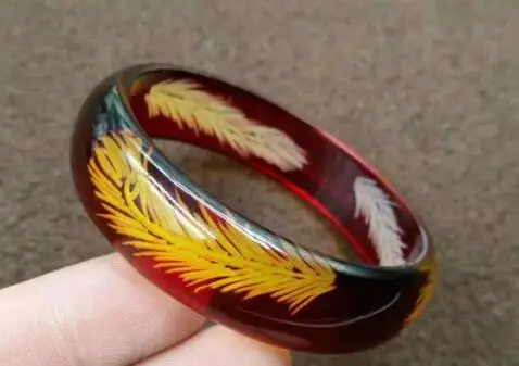 

Selling Jewelry>>>Natural new ice feather carved beeswax bracelet men and women