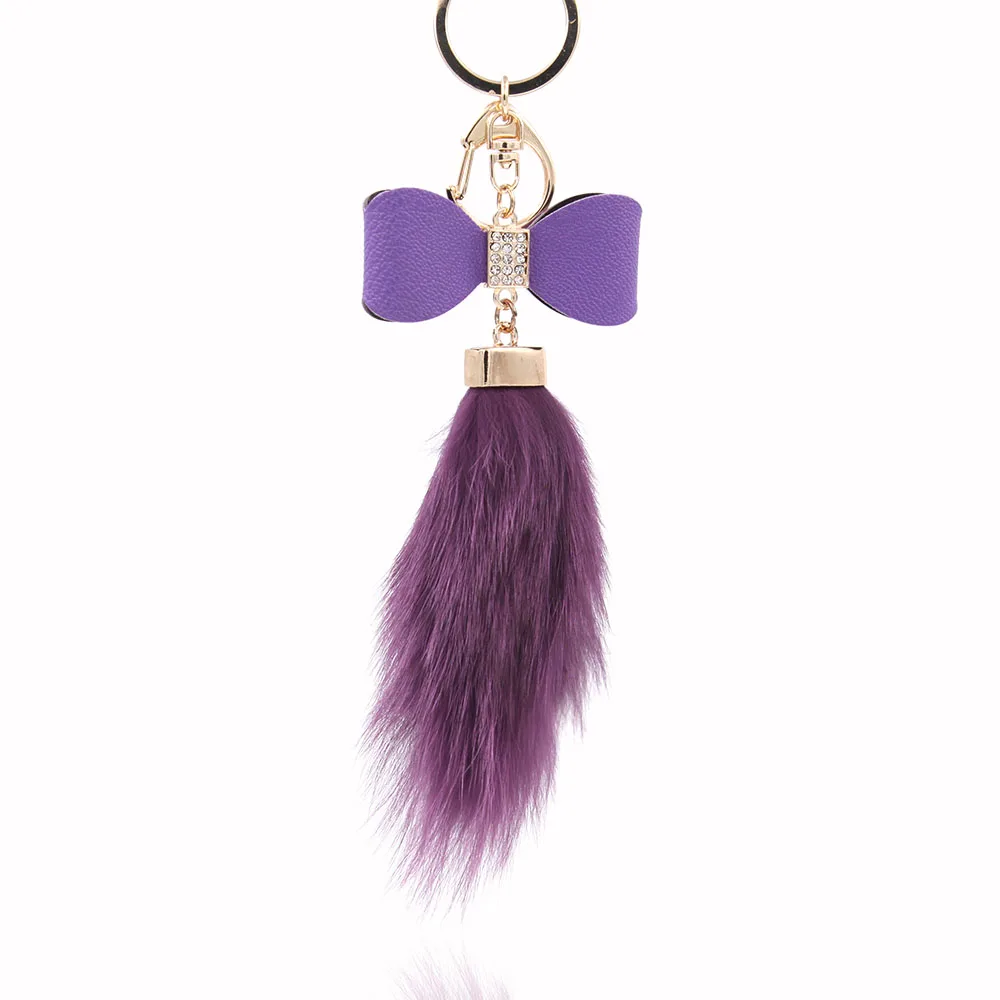 Кожаный брелок с бантом и меховым шариком аксессуар для сумки кристаллами