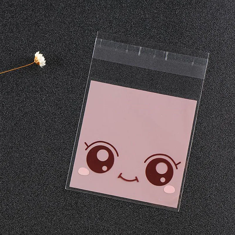 Сумка для упаковки конфет с рисунком большие глаза девочек 100 шт. 7*10 см