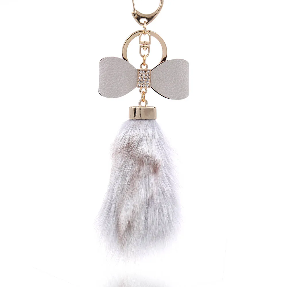 Кожаный брелок с бантом и меховым шариком аксессуар для сумки кристаллами