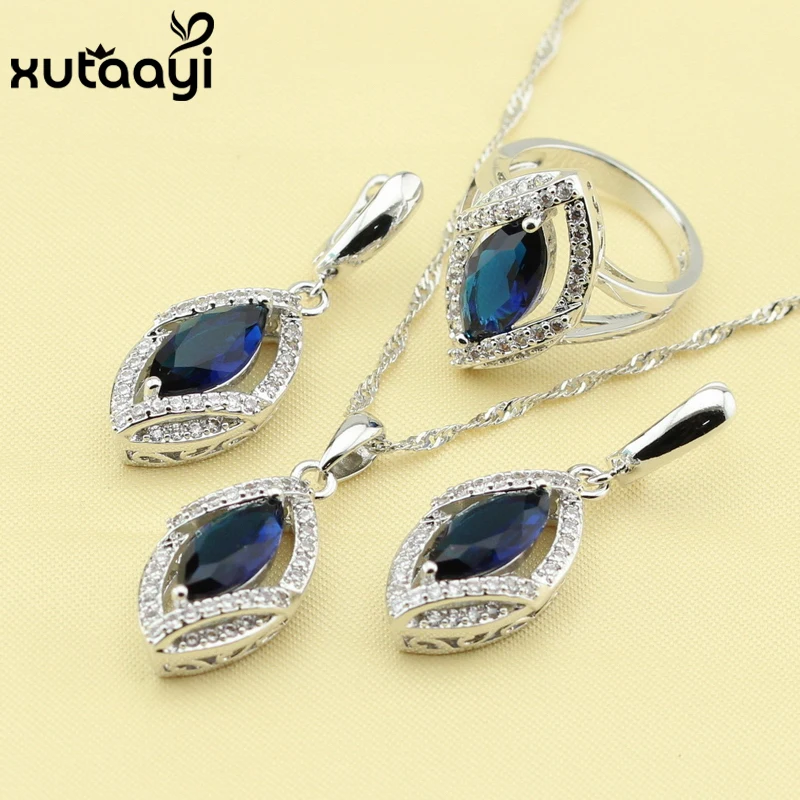 

Комплект свадебных ювелирных изделий с синим фианитом и белыми камнями, серебристого цвета, серьги, кольцо с подвеской