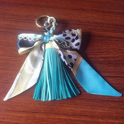 light blue Felyskep Лидер продаж корейский стиль шелковые шарфы бант из искусственной кожи брелоки в виде кисточки для женщин сумка или автомобильные подвесные брелоки 233WA - Цвет: light blue