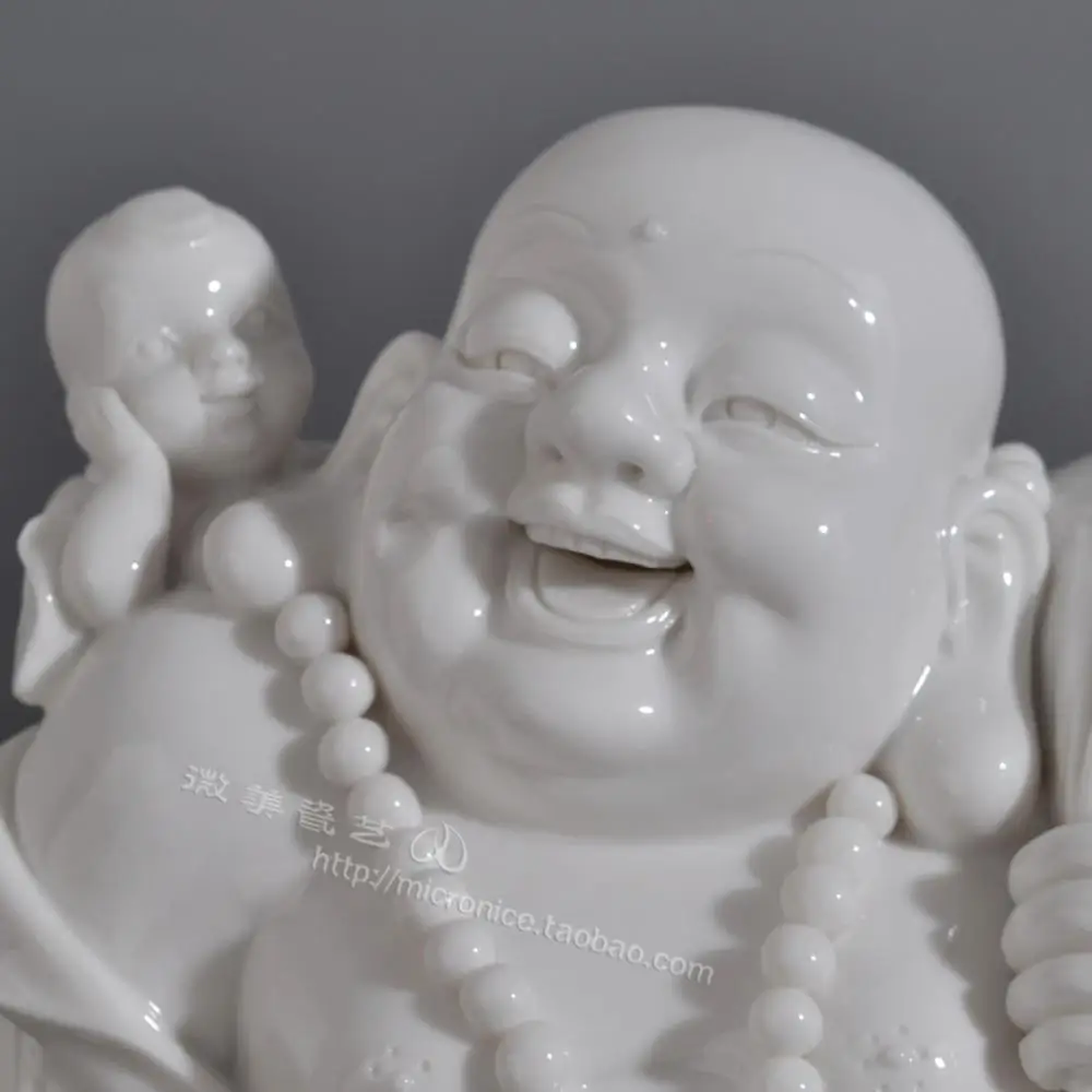 

Dehua white porcelain 11 inch boy Maitreya Buddha boy play Maitreya ceramic decoration process mascot high-grade decoration