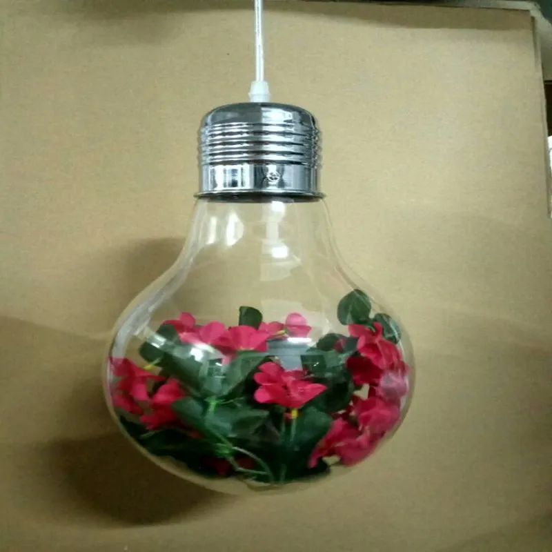 Растение в кофейне с большой лампочкой подвесной светильник из зеленого стекла