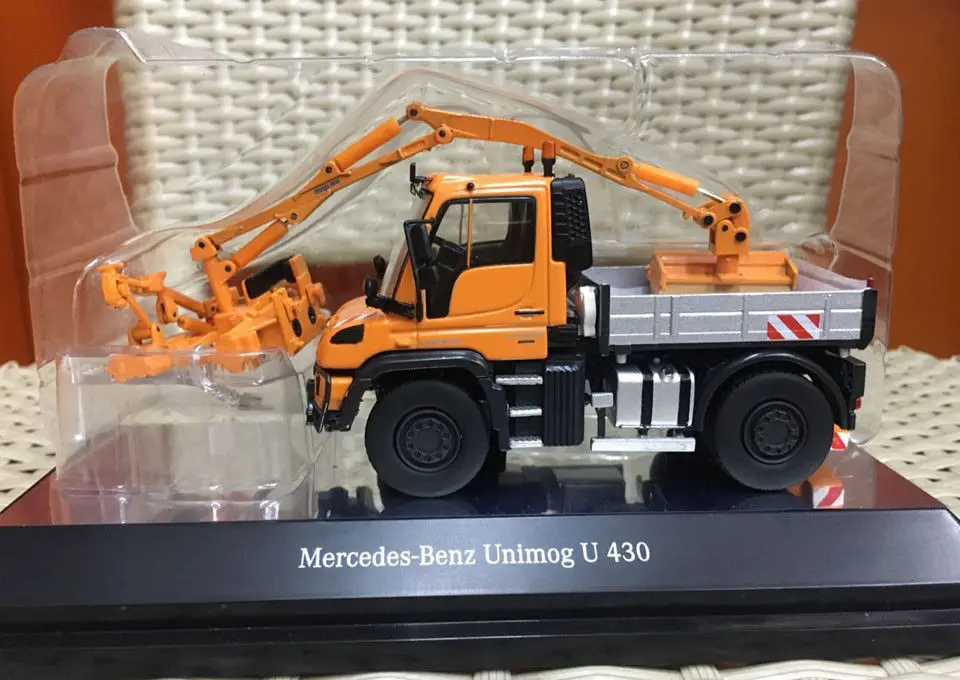 

Mercedes-Benz Unimog U 430 With Combine Mowing Machine Orange 1/50 By NZG 9101