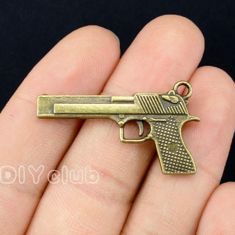 

25pcs- Gun Charms Antique Bronze Pistol Charms Pendant 2 Sided 35x20mm