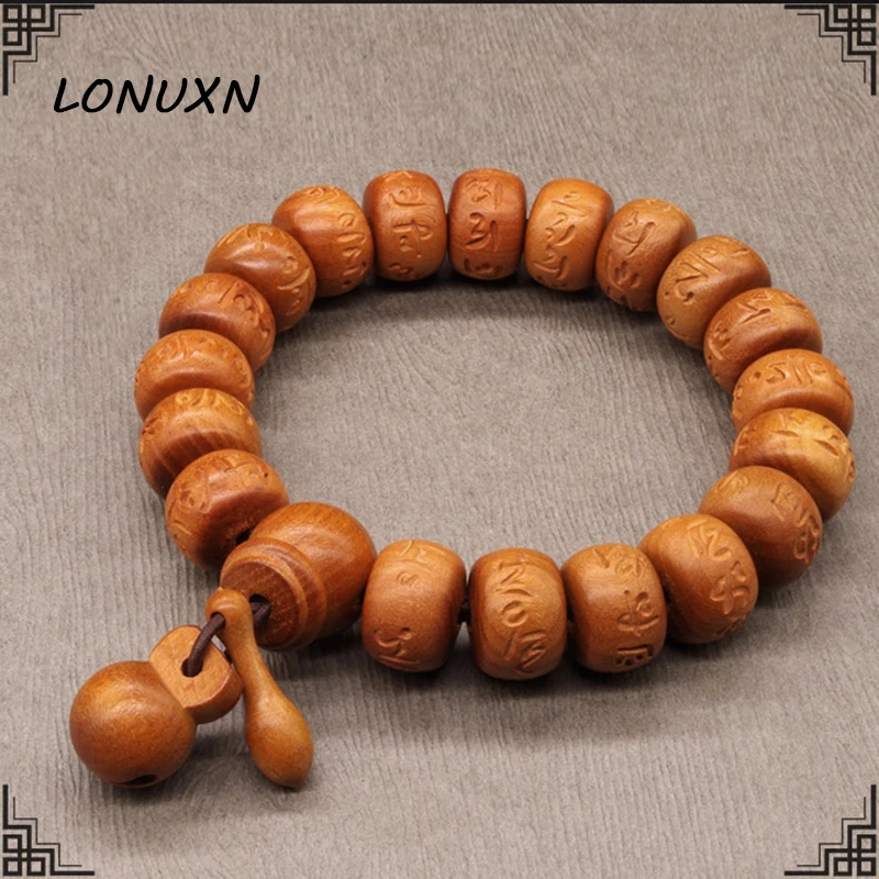 Браслет с бусинами из натурального персикового дерева 12*15*17 мм ручной работы