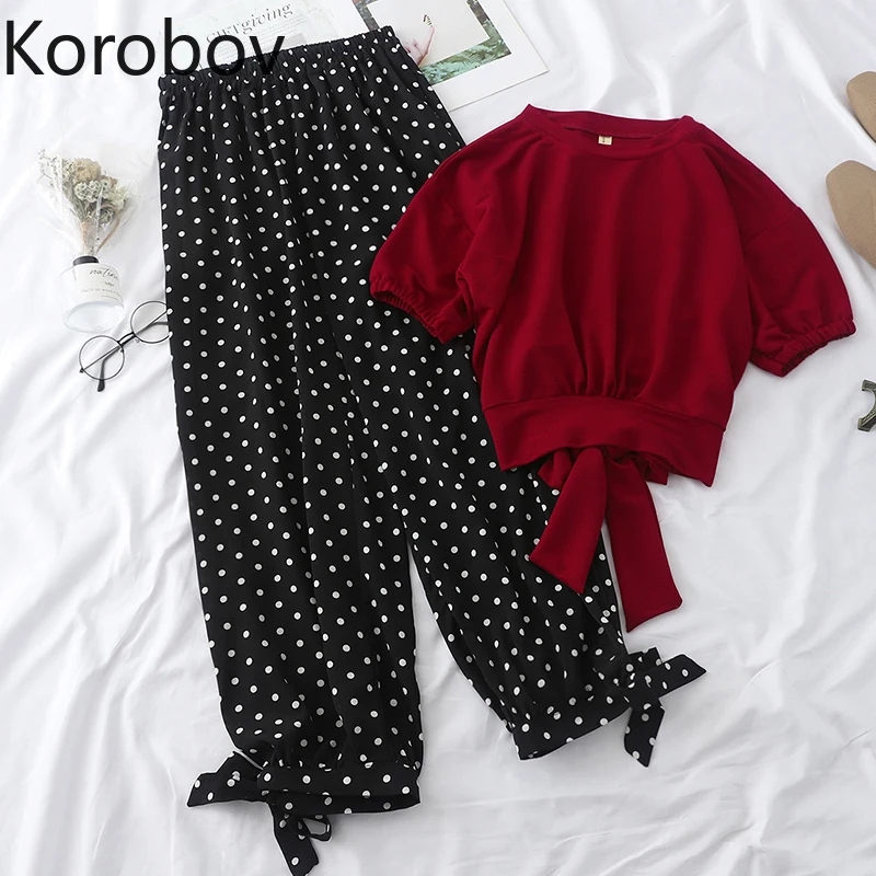 Женский бандажный костюм Korobov красный короткий топ с бантом + черные штаны