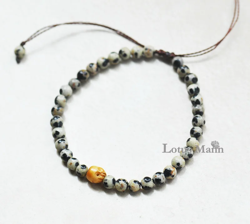 

Sploshes stone bone carving skeleton bracelet