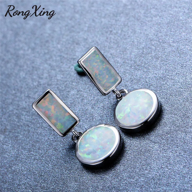 Женские серьги подвески с опалом серебристого цвета| |