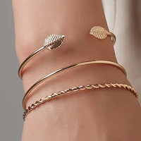 three piece open golden two tree leaves volution smooth shape elegant bangles for women
