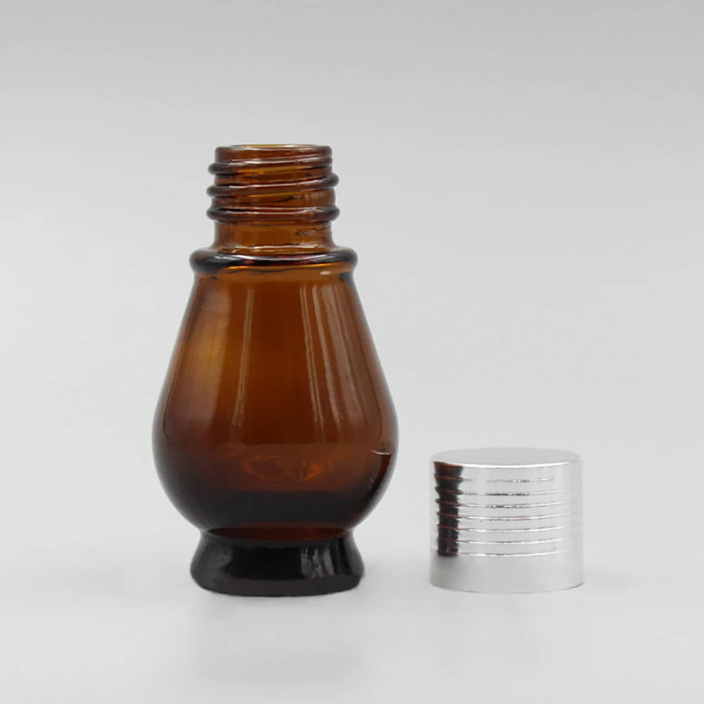 100pcs/lot 10ml amber ground shape glass lotion bottle with silver cap, oil bottle hotsale