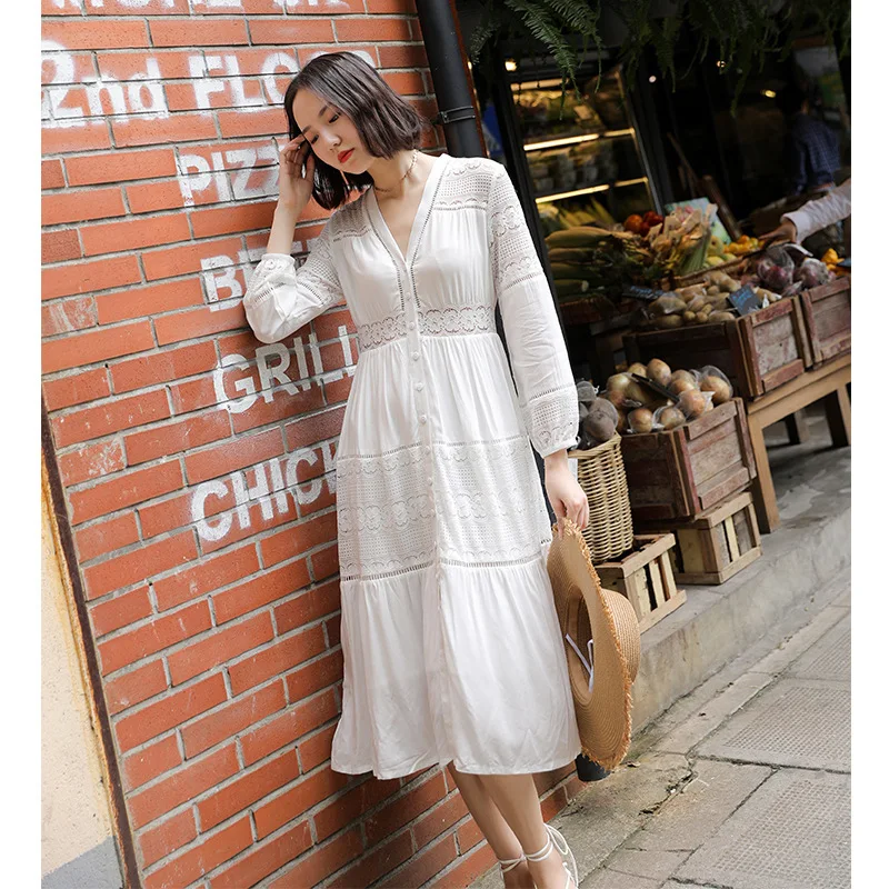 

Europe and the United States women's seaside holiday lace stitching hollow V-neck single-breasted seven-point sleeve dress