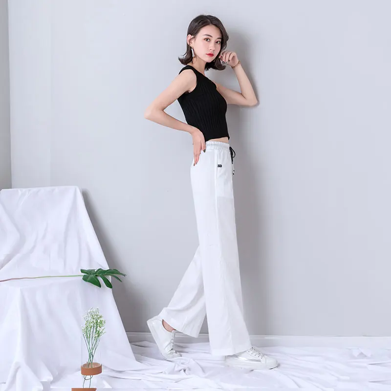 Белые женские широкие брюки 2019 новые летние с высокой талией на шнуровке