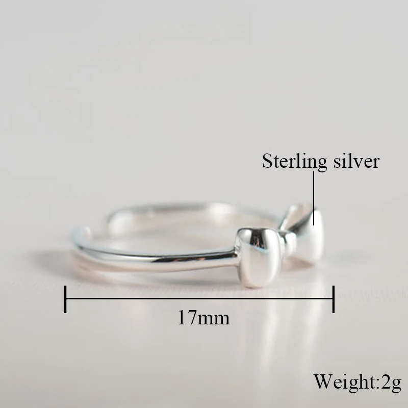 Женское кольцо с маленьким бантиком регулируемое средней длины на палец