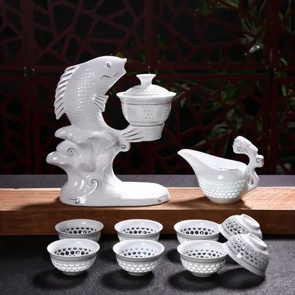 

Automatic White Ceramic Hollow Transparent Blue and White Tea Pot Cup New Jingdezhen Fish Porcelain Dehua Kung Fu Tea Set Cups