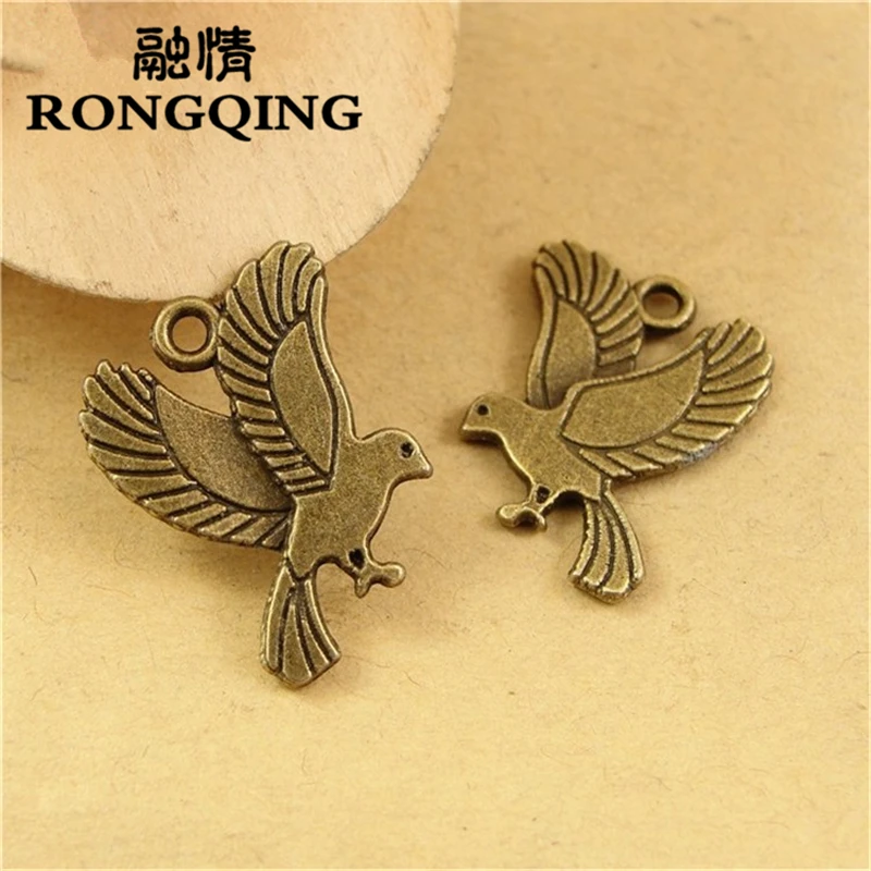 

RONGQING 100pcs/lot 21*17MM Pigeon Charms Antique Bronze Dove Pendant for Jewelry Accessories Bird of Peace