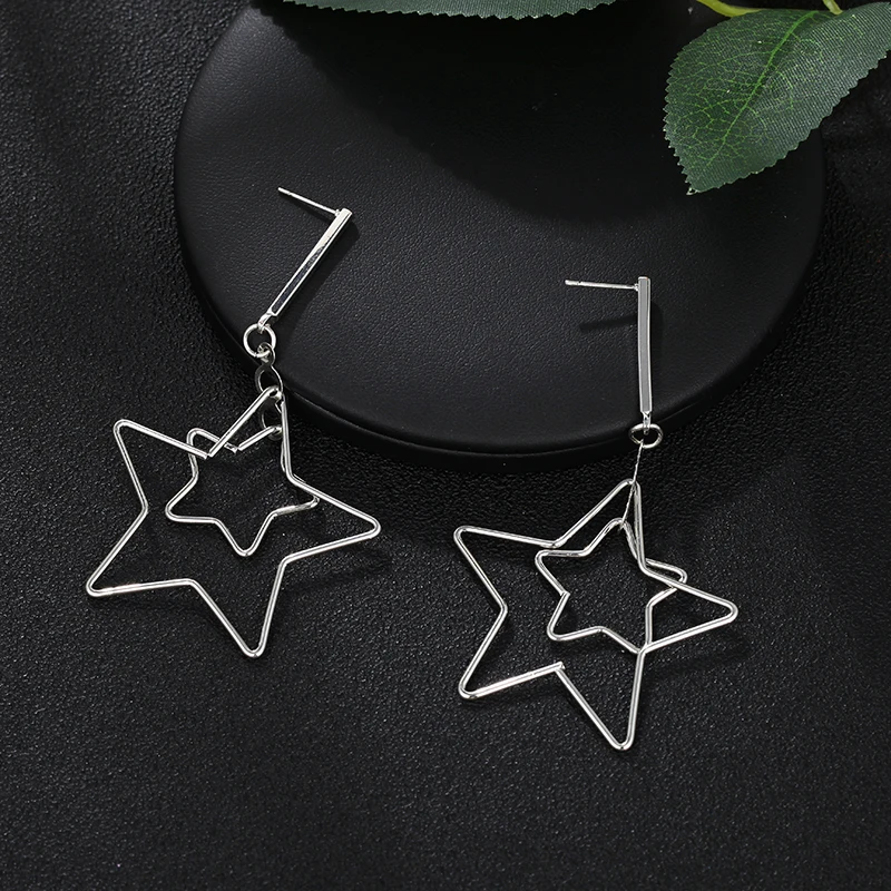 Женские серьги подвески с большими звездами золотистые массивные модные