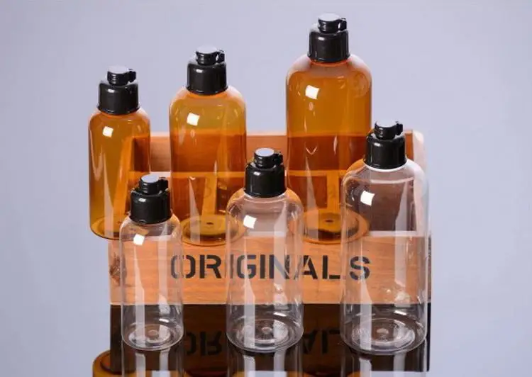 

by DHL 500Pcs/Lot Clear/Amber Cosmetic Bottles with Black Flip Top,luxury cosmetic PET plastic bottle 100ml/200ml/300ml 10001758