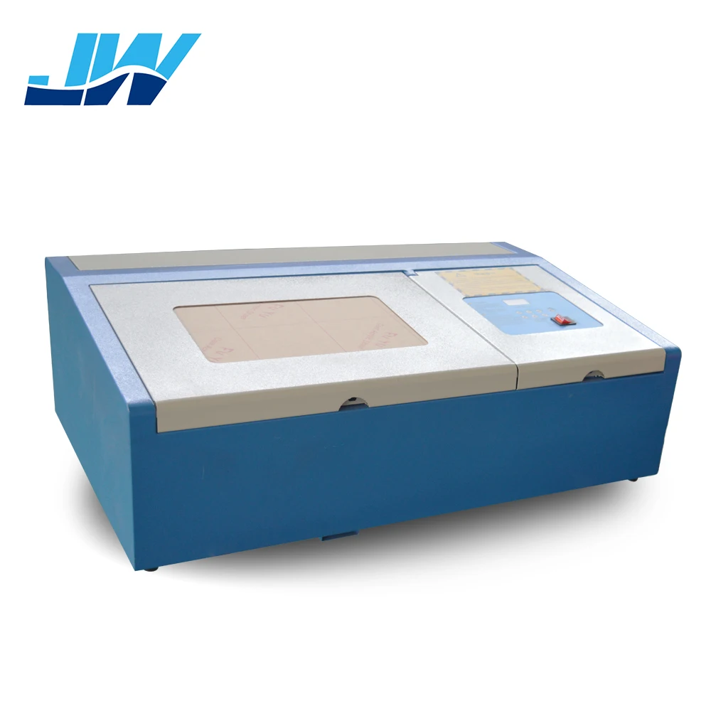 Цена по прейскуранту завода 50W CNC CO2 резиновый лазерный гравировальный станок |
