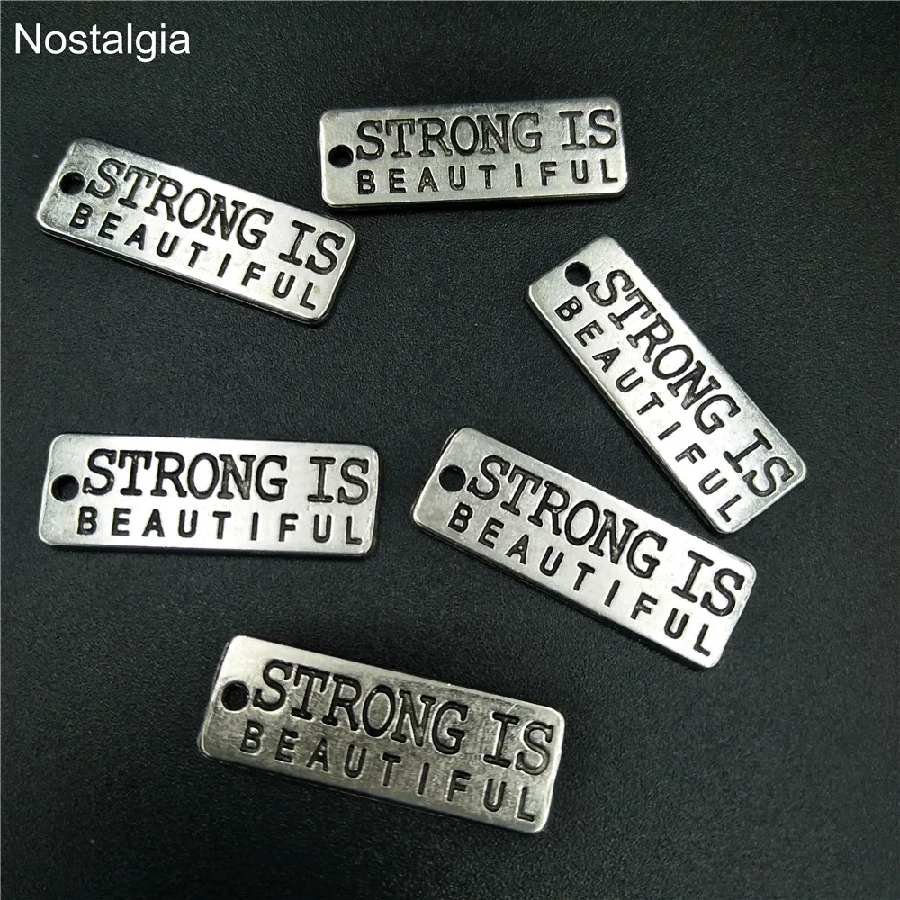 

Nostalgia 10Pcs Strong Is Beautiful Inspirational Charms Fitness Message Stamped On Rectangle Tag Pendant 10*28MM