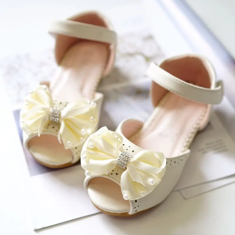 Летние детские сандалии модные на плоской подошве с бантом для девочек детей