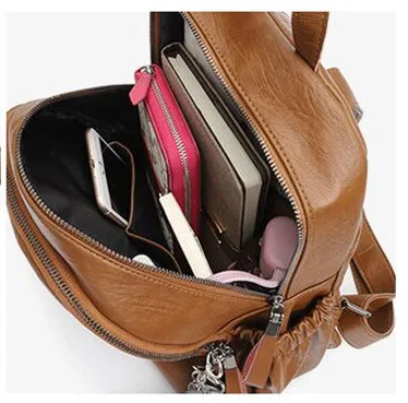 Leather shoulder bag female tide new trend explosion models student backpack leisure travel luggage to send bear ornaments |
