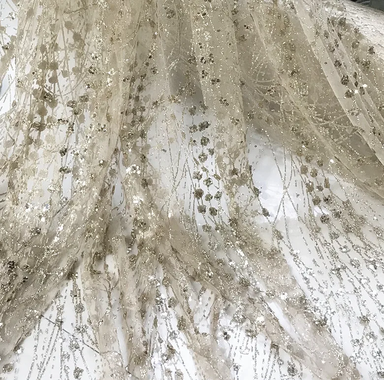 Блестящая блестящая сетчатая ткань цвета шампанского золотистого яркого