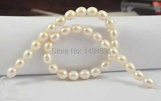 

Wholesale Pearl Jewelry, Large Charm Luster Rice White Freshwater Pearl Gem Full One Strand 10-11mm 15 Inches - Free Shipping