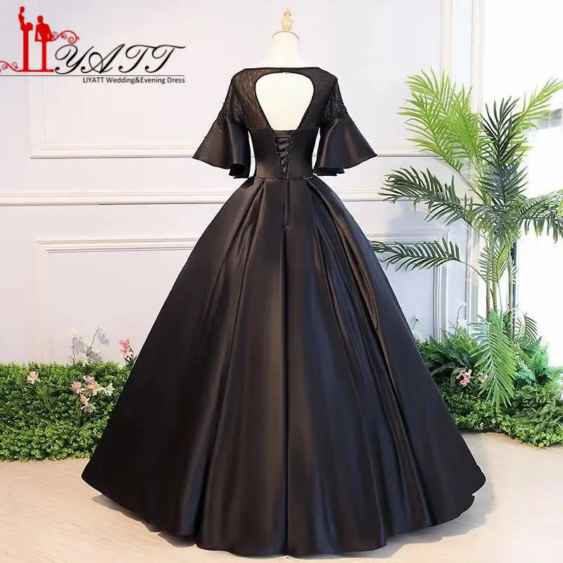 Женское длинное атласное платье LIYATT черное с рукавами воланами и аппликацией на