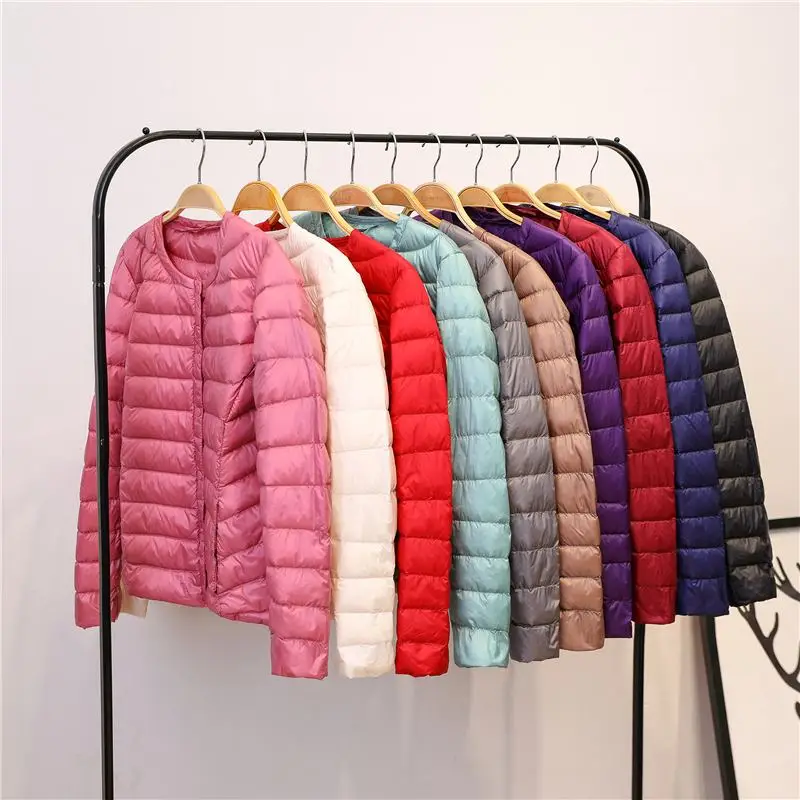 Пуховик женский теплый однотонный с круглым вырезом батальных размеров 3XL