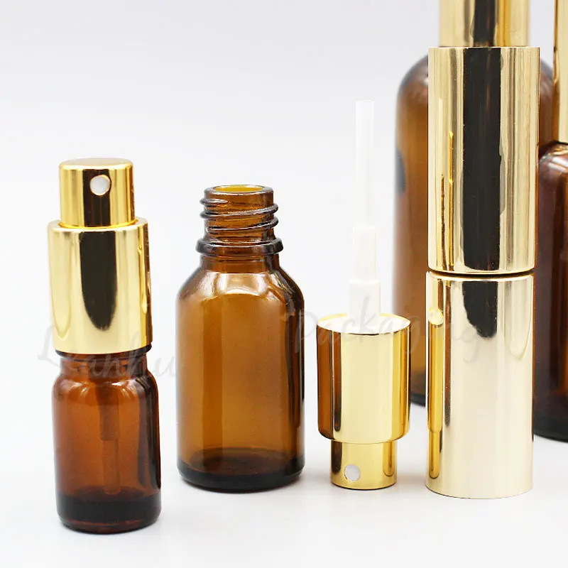 Коричневые стеклянные флаконы для духов с золотистым распылителем спрей