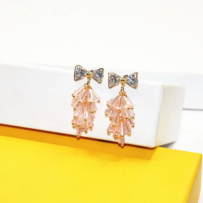 Женские серьги с кисточками и кристаллами Ajojewel бантом из циркония розового