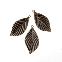 free shipping 15pcs bronze leaf filigree wraps connectors metal crafts gift decoration diy 72x33mm