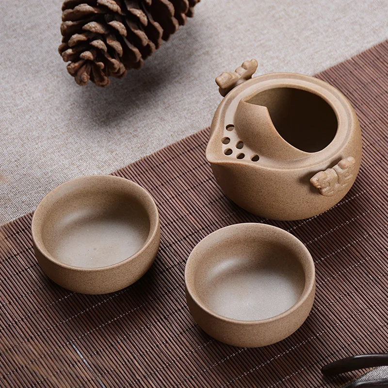 

Coarse pottery fast cups pottery Kung Fu tea with a pot of two cups readily teapot portable tea set
