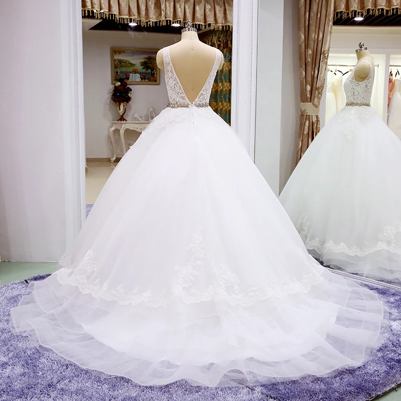 

Elegant Illusion Wedding Dresses Appliques Crystal Belt Backless Dubai Bridal Gowns With Train Appliques Button Robe De Mariee