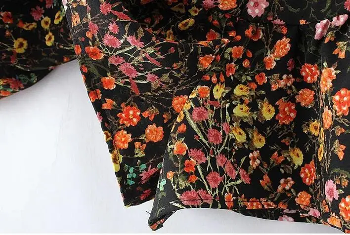 Женский комбинезон с завязками на спине черный пикантный круглым вырезом