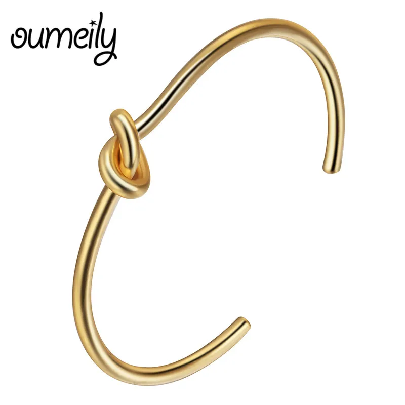 Женский браслет с завязками розовое золото простой закрученный манжетами