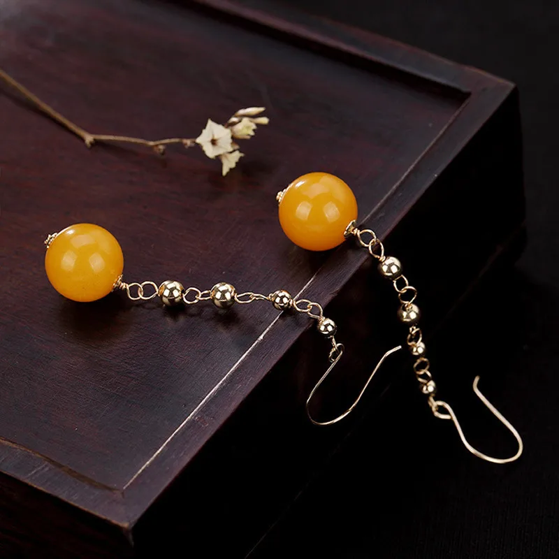 Женские серьги-подвески из серебра 100% пробы с натуральными янтарными шариками |