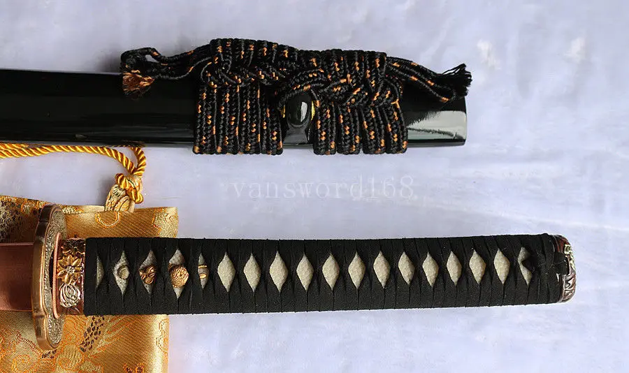 

hand forged damascus steel clay tempered blade Japanese samurai katana sword.