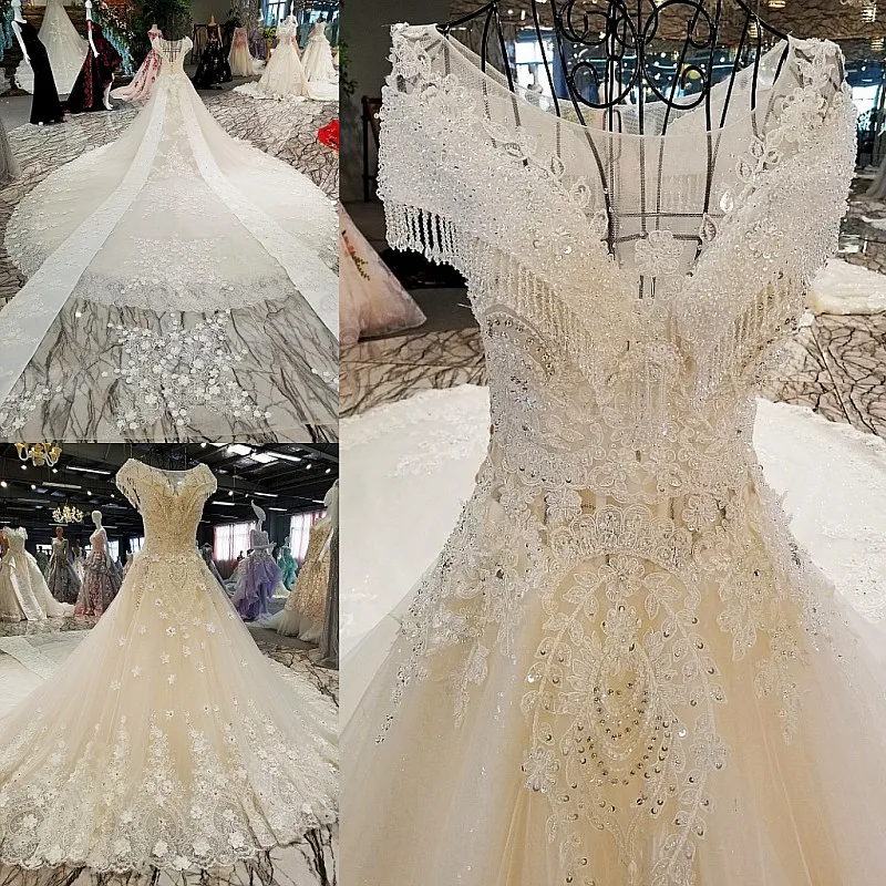 LS00302 свадебное платьебез спинки крышка рукава большой лук назад кружева бальное