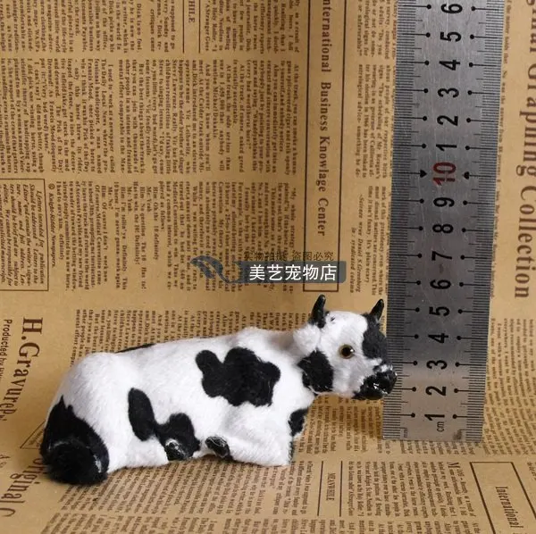 

cute simulation cow toy lifelike handicraft lying cow doll gift about 12x5x6cm