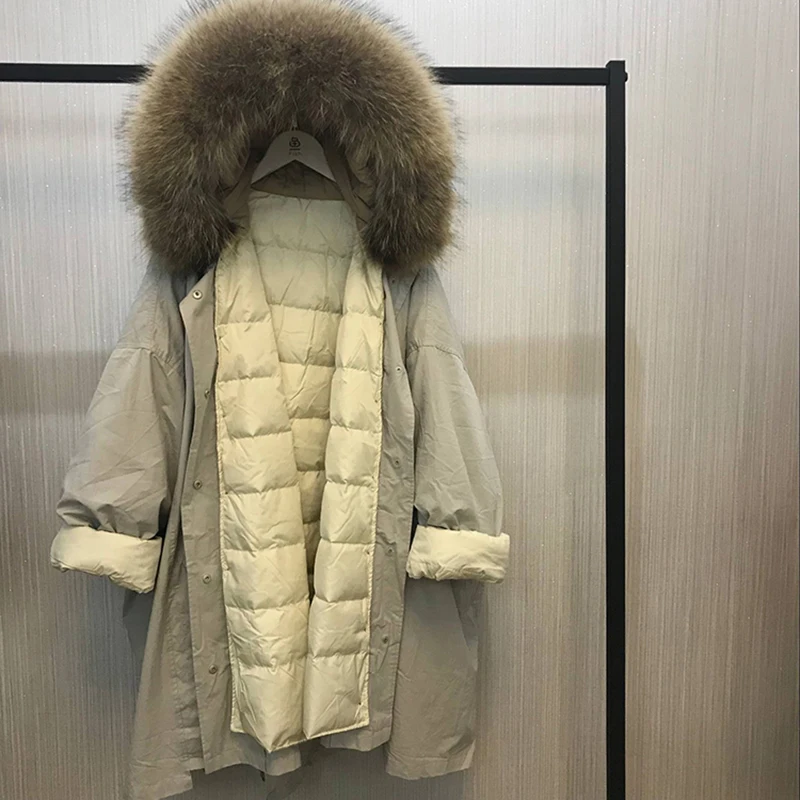 Большой натуральный мех енота зимняя куртка женская Свободная длинная пуховая парка с капюшоном белая пуховая куртка размера плюс женское теплое пальто