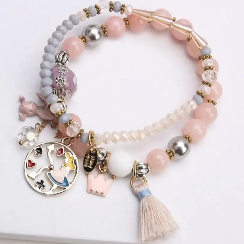 

Женский браслет с подвесками в виде короны